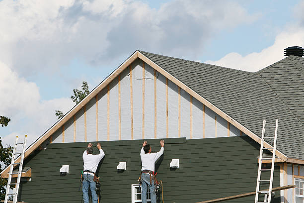 Professional Siding Installation technician working in Fort Myers Beach, FL